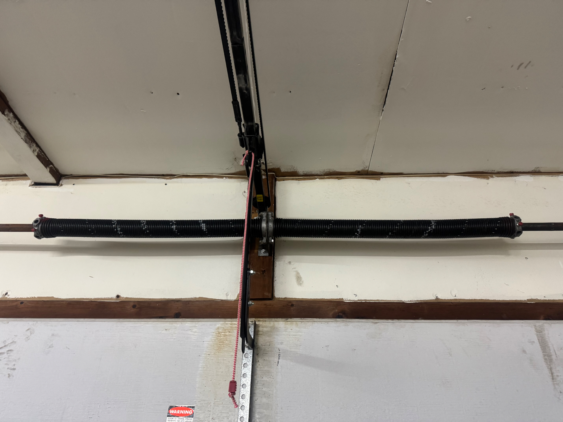 After — Broken garage door springs replaced with new torsion springs