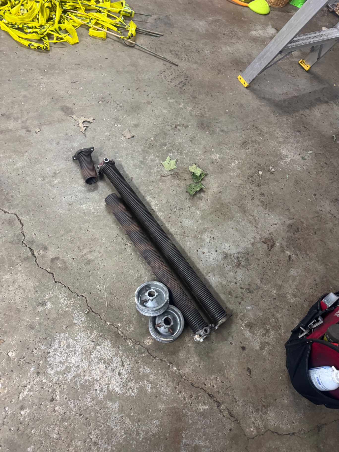 Before — Snapped garage door spring replaced and door re-balanced